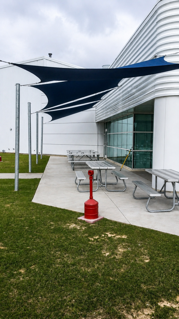 New Industrial patio with modern shade sails