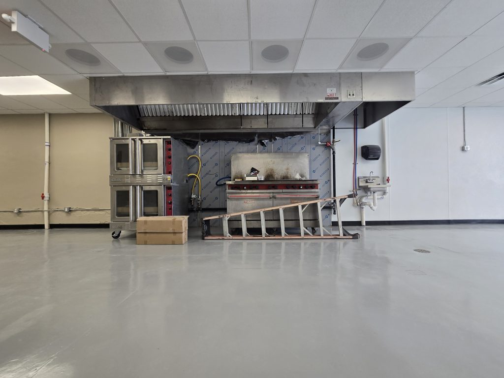 Turned space into restaurant. kitchen hood installation. gas lines. ACT